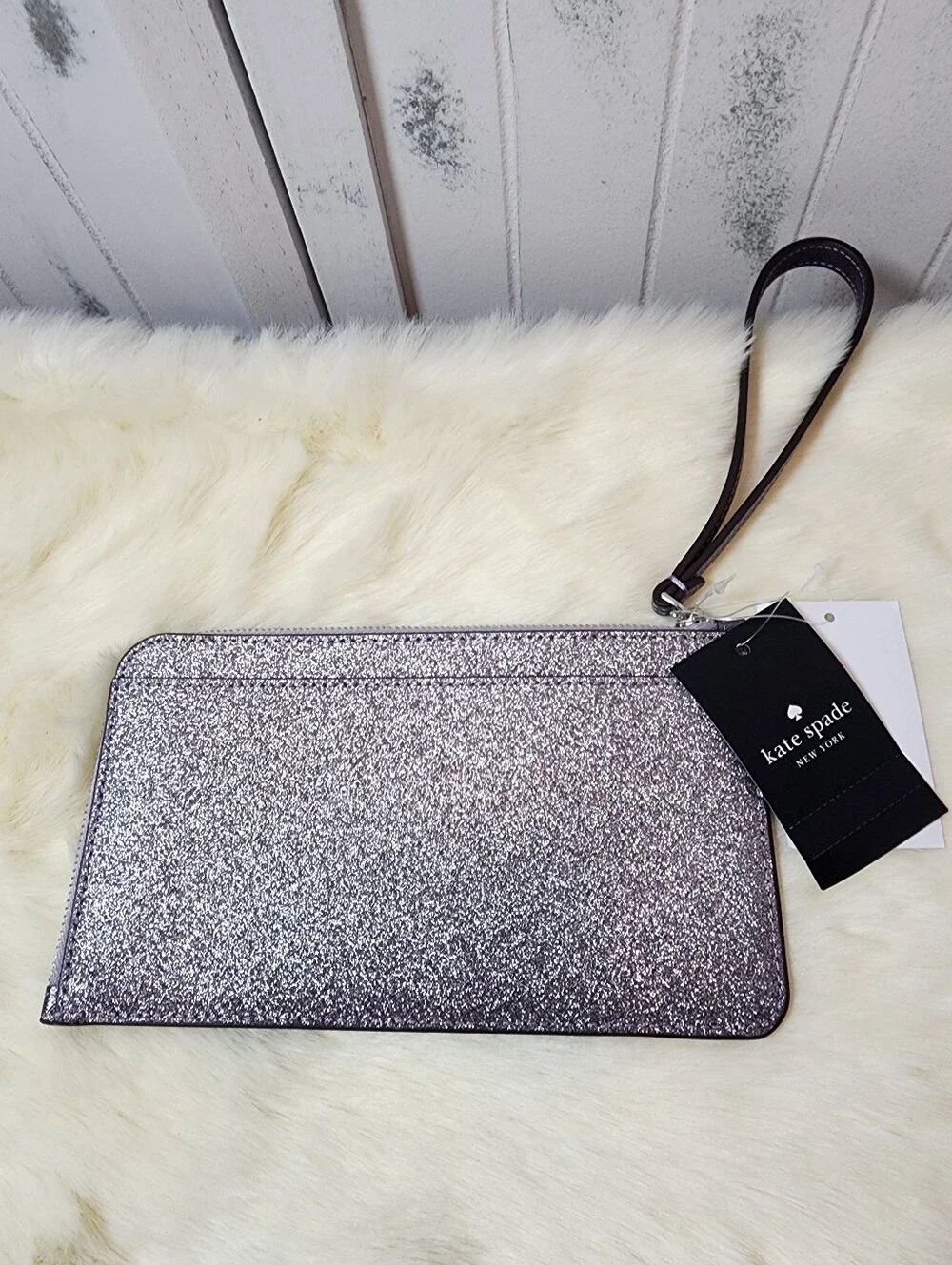 Kate Spade Lucy Silver Glitter Wristlet.